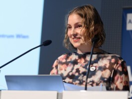 Portrait of Ella speaking publicly. 